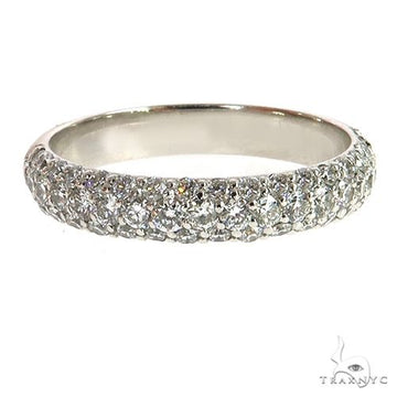 Three-row diamond wedding band in white gold with pave-set diamonds.