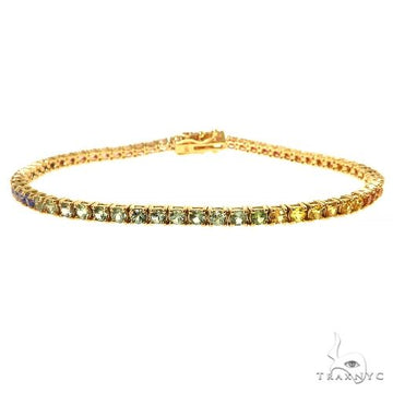 Yellow gold tennis bracelet with rainbow sapphire gemstones in a 2.4mm setting.