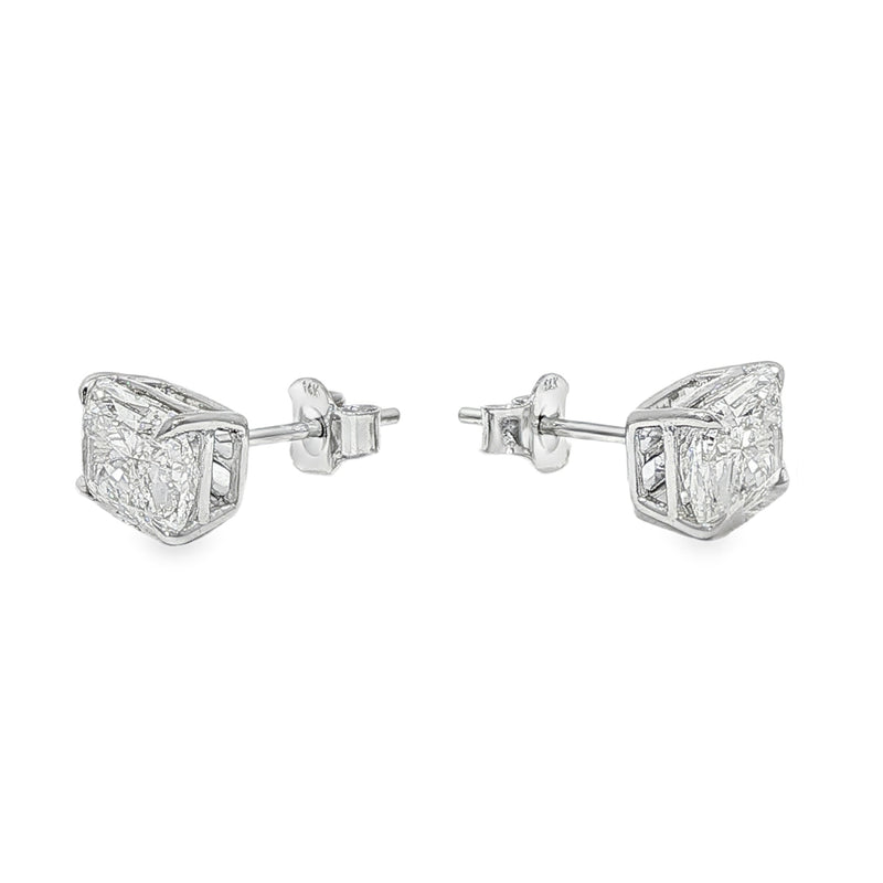Pair of radiant cut diamond stud earrings with four-prong white gold setting, brilliant facets