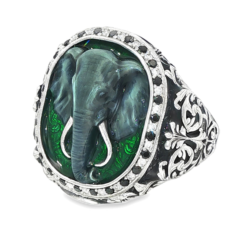 Silver ring with black diamond border and enamel elephant design on top.