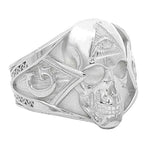 Silver skull ring with all-seeing eye pyramid and geometric details, matte finish.