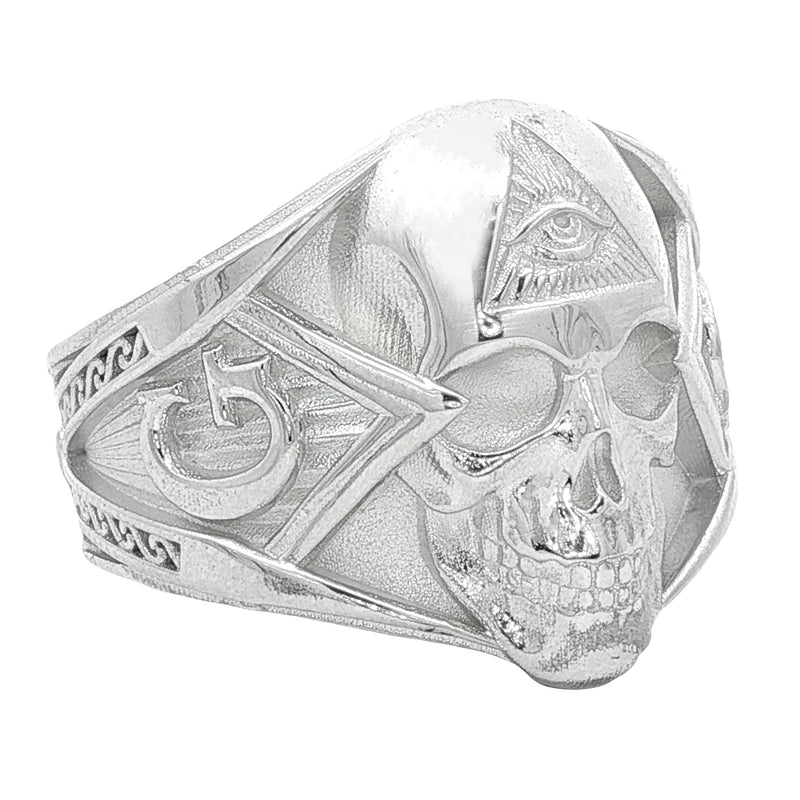 Silver skull ring with all-seeing eye pyramid and geometric details, matte finish.