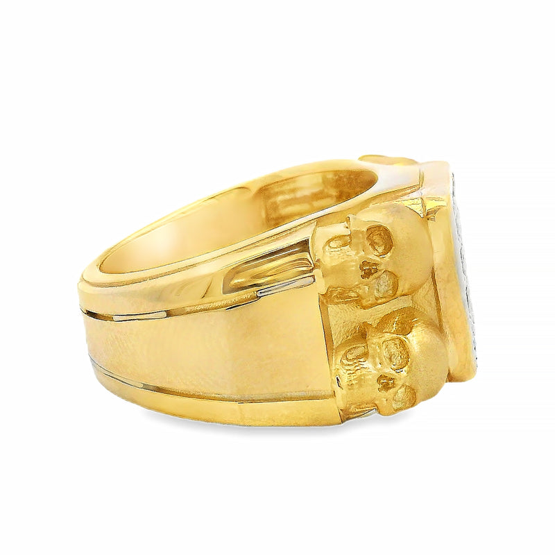 Yellow gold men's ring with double skull design and square diamond cluster center.