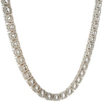 White gold tennis chain with round 75 pointer diamonds, sleek luxury men's jewelry.