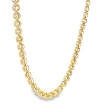 Yellow gold tennis chain necklace with round sparkling diamonds in a classic setting.