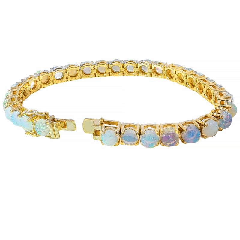 Yellow gold tennis bracelet with oval opal gemstones in bezel settings, unisex design.