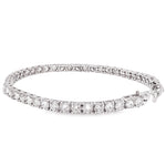 White gold tennis bracelet with alternating upside down round diamonds in a sleek setting.