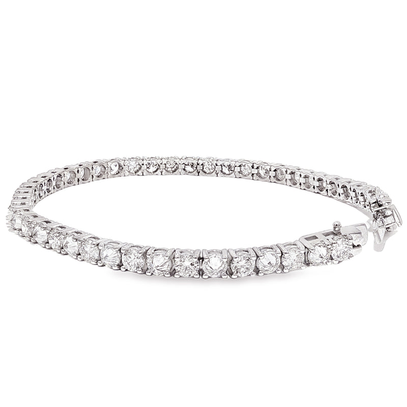 White gold tennis bracelet with alternating upside down round diamonds in a sleek setting.