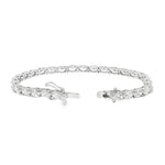 White gold tennis bracelet with oval-cut diamonds in a linked setting.