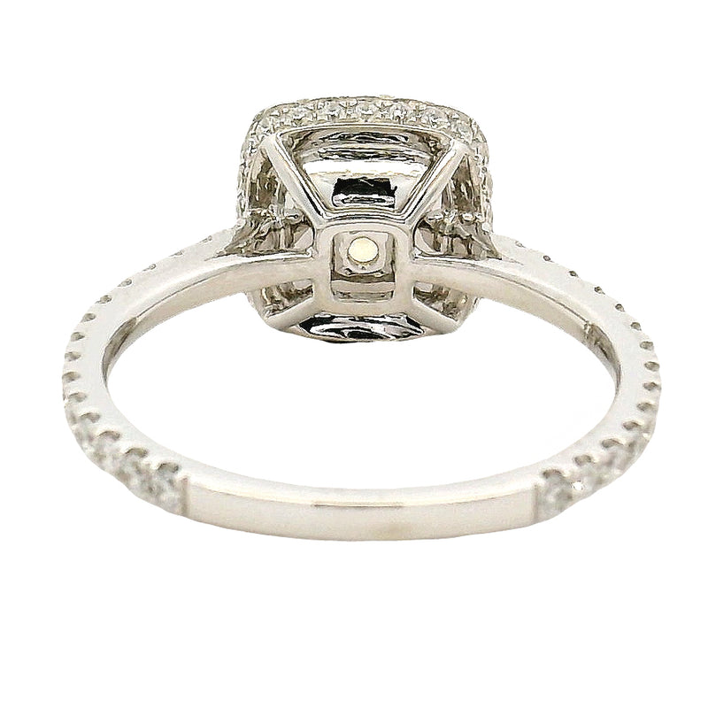 Cushion-cut yellow diamond ring with halo of white diamonds on a white gold band.