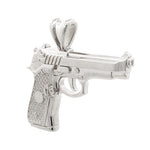 Sterling silver pistol-shaped pendant with textured grip and detailed barrel.