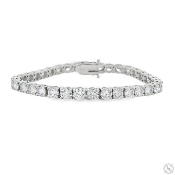 Lab diamond tennis bracelet in polished white metal – front-facing view of full row of round-cut stones