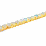 Yellow gold opal tennis bracelet with round gemstone settings and polished finish.