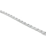 White gold tennis bracelet with oval-cut diamonds in a linked setting.