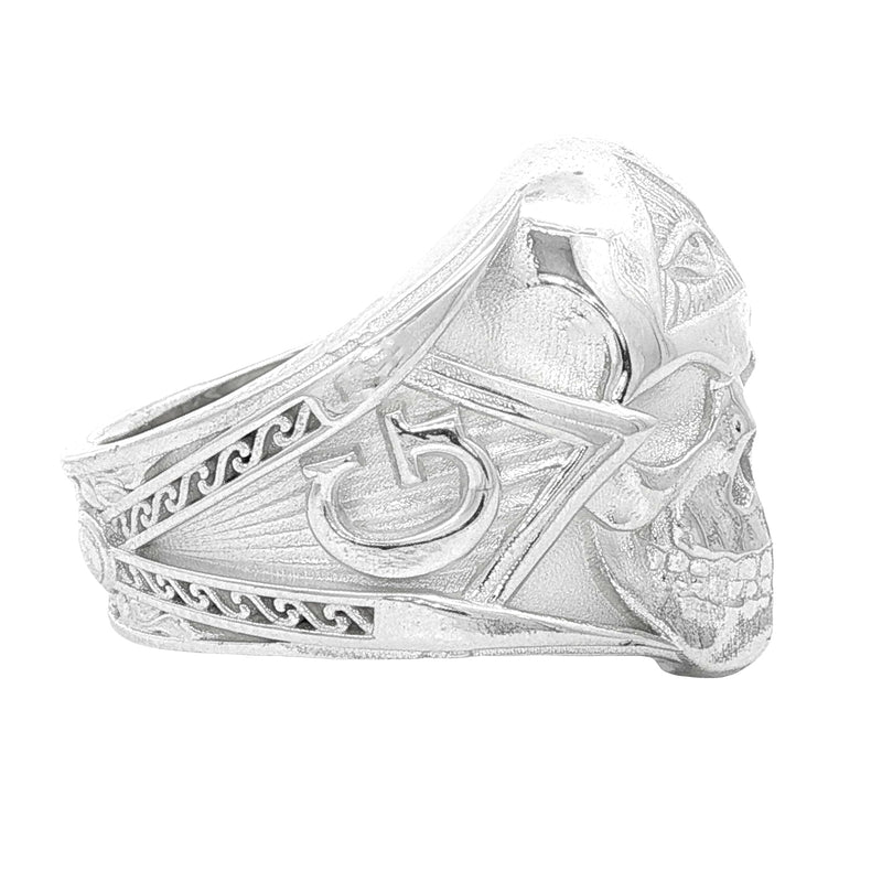 Silver skull ring with all-seeing eye pyramid and geometric details, matte finish.