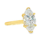 Yellow gold ring with marquise-cut solitaire diamond and four prongs.
