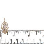 Rose gold Hamsa pendant with pave diamonds and marquise center stone on bail.