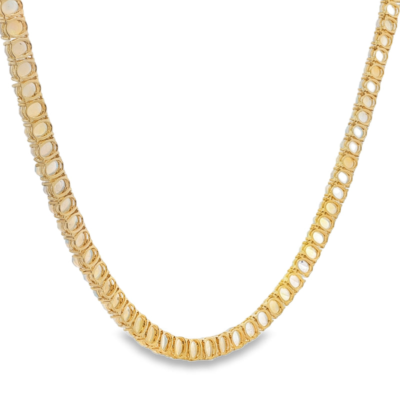Yellow gold chain necklace with linked rectangular elements, polished finish, elegant design.