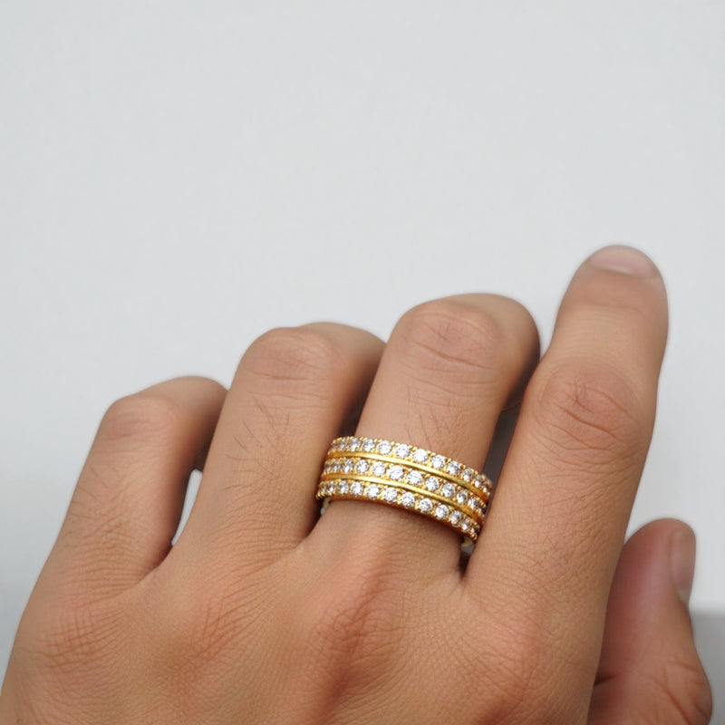 Yellow gold three-row wedding band with round diamonds in a sleek, polished setting.
