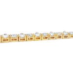 Yellow gold tennis chain with alternating upside down round diamonds.
