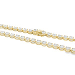 Yellow gold tennis chain necklace with round sparkling diamonds in a classic setting.