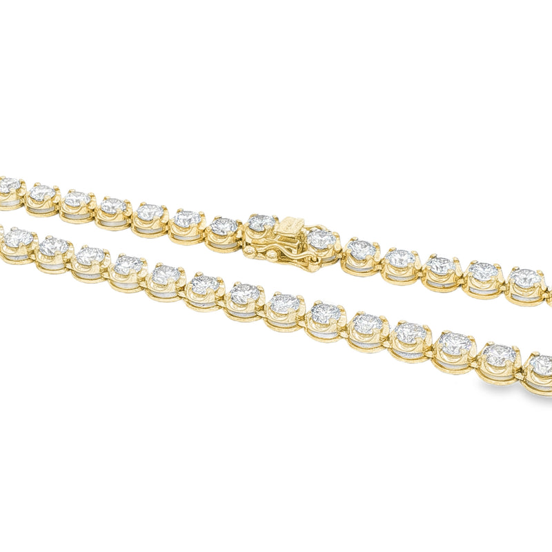 Yellow gold tennis chain necklace with round sparkling diamonds in a classic setting.
