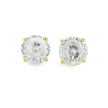 Round Portuguese diamond stud earrings set in yellow gold prongs.