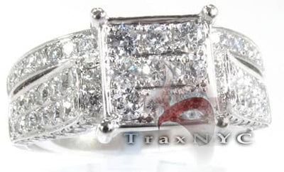 Wide silver engagement ring with square cluster of small sparkling diamonds.