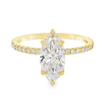 Yellow gold ring with marquise-cut diamond and hidden halo of smaller diamonds on band.