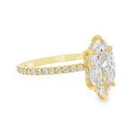 Yellow gold ring with marquise-cut diamond and hidden halo of smaller diamonds on band.