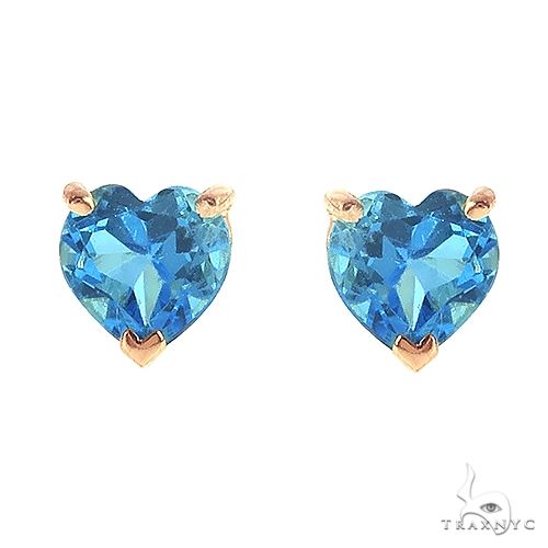 14K rose gold heart-shaped Swiss blue topaz stud earrings with prong settings