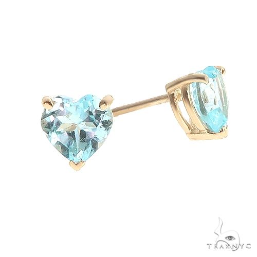 Heart shape blue topaz stud earrings in 14k yellow gold — front-facing pair showing stone color and setting detail