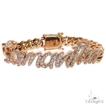 Custom diamond name bracelet on Miami Cuban curb links in 14k yellow gold – prong-set stones, angled top view