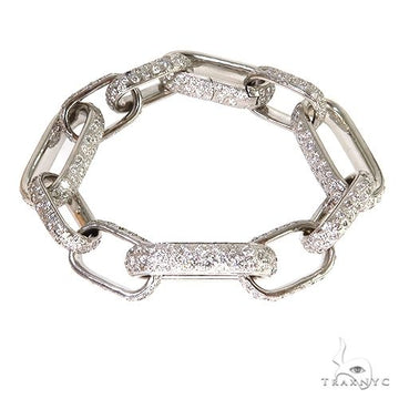 Custom diamond link bracelet in gold with pave-set round diamonds across fancy link design, front view