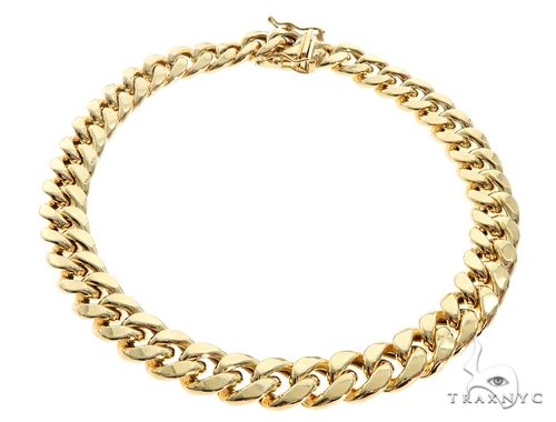Men's Miami Cuban link bracelet in polished yellow gold tone, 9mm hollow links, flat lay angle