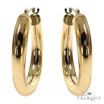 14K gold hoop earrings, smooth continuous circle silhouette, yellow gold finish, front angle