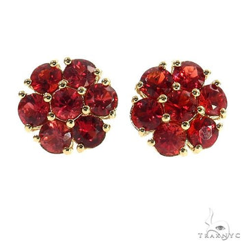 Large flower cluster earrings with red sapphires and diamond accents in a full floral setting