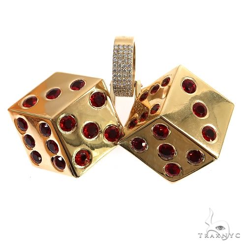 Custom dice pendant in gold with diamonds and red sapphire accents, angled three-quarter view showing multiple faces