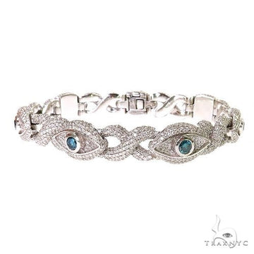Evil Eye Infinity Diamond Bracelet in gold – evil eye and infinity motifs set with diamonds, close-up wrist angle