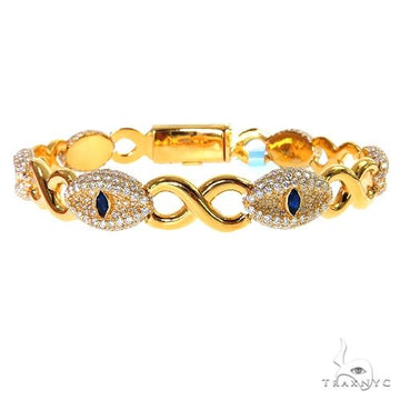 Evil eye infinity diamond bracelet in gold with evil eye and infinity motif set with diamonds, front view