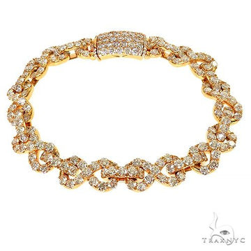 Men's infinity diamond bracelet in gold – figure-eight diamond links, flat wrist profile, close-up front angle