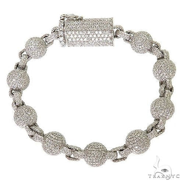 Men's diamond ball bracelet in gold – close-up of sphere links with diamond-set surfaces