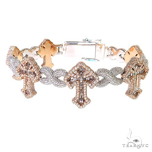 Baguette diamond fleur de lis cross bracelet in gold – fancy link construction with repeating cross motif, flat lay angle