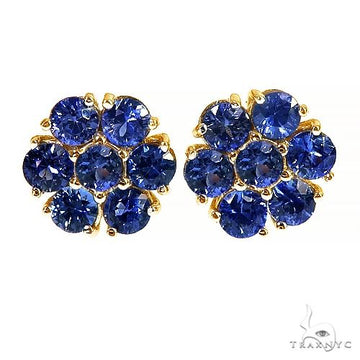 Small flower cluster earrings set with green sapphire stones — front view showing petal motif detail