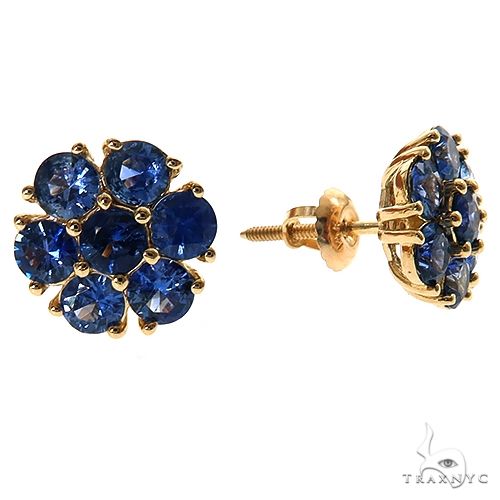 Yellow gold flower earrings with clustered deep blue sapphire gemstones