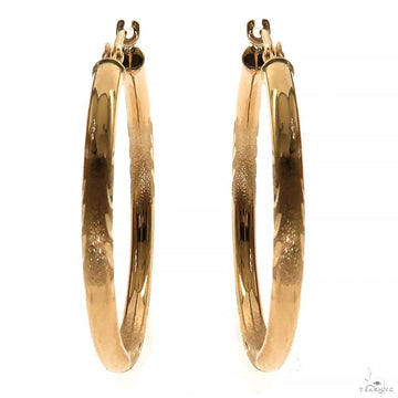 14k yellow gold hoop earrings, 25mm diameter, polished finish — front angle view