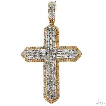 Yellow gold cross pendant with baguette-cut diamonds and a diamond-studded bail.