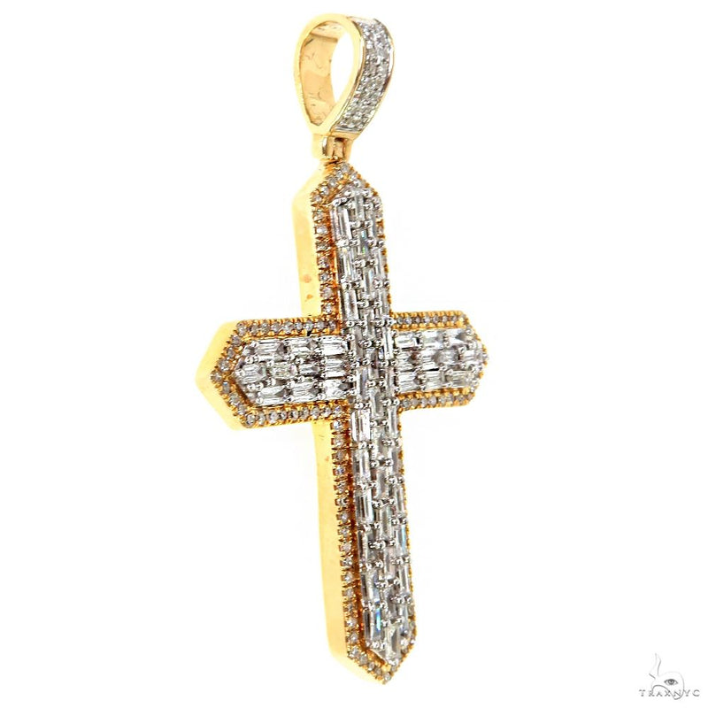 Yellow gold cross pendant with baguette-cut diamonds and a diamond-studded bail