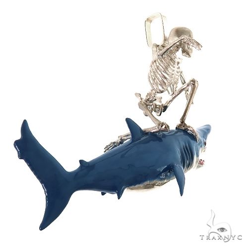 Silver skeleton surfer pendant riding a detailed blue shark with open jaws