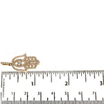 Rose gold Hamsa pendant with pave diamonds and marquise center stone on bail.